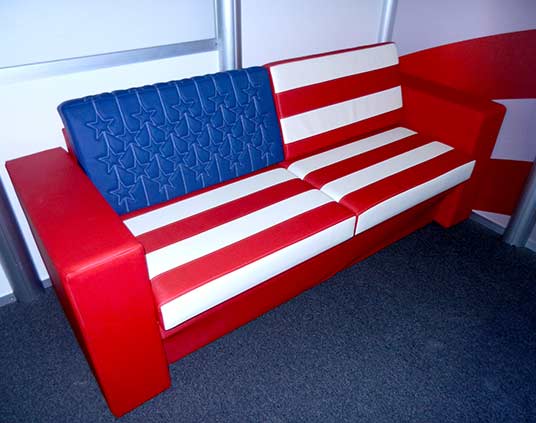Red, white and blue flag-themed sofa with custom stitched patterns.