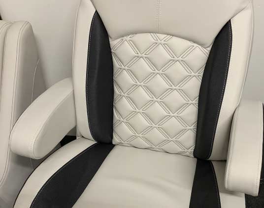 Beige and charcoal RV captains chair with double-x stitch pattern inlay.